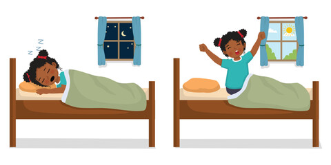Cute little African girl sleeping in the bed at night and wake up in the morning
