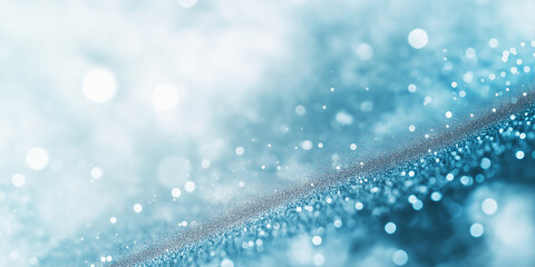 Abstract close-up of frost-covered branches with snowflakes falling gently. The icy details and blurred blue background convey the crispness of winter.