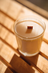 Scented candles on a wooden table. 