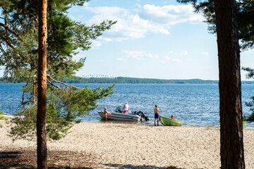 July 2024 Finland Lahti Lake Vesijärvi.Lahti Finland people relaxing on the lake with boats and a...