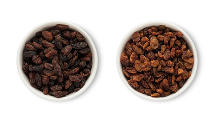 Bowl plates with sweet dark raisins made from red grapes isolated on white background.Top view.