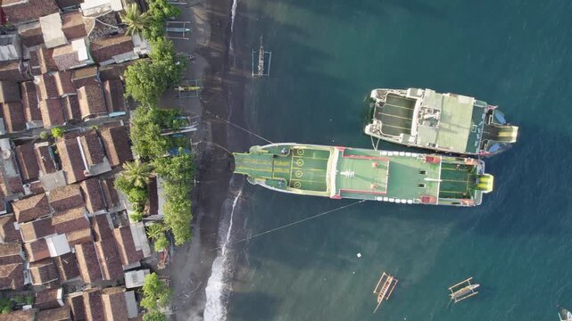 Top-down view of the ferry at Ketapang Banyuwangi Sea, Indonesia, at the ferry port terminal going towards Bali island.