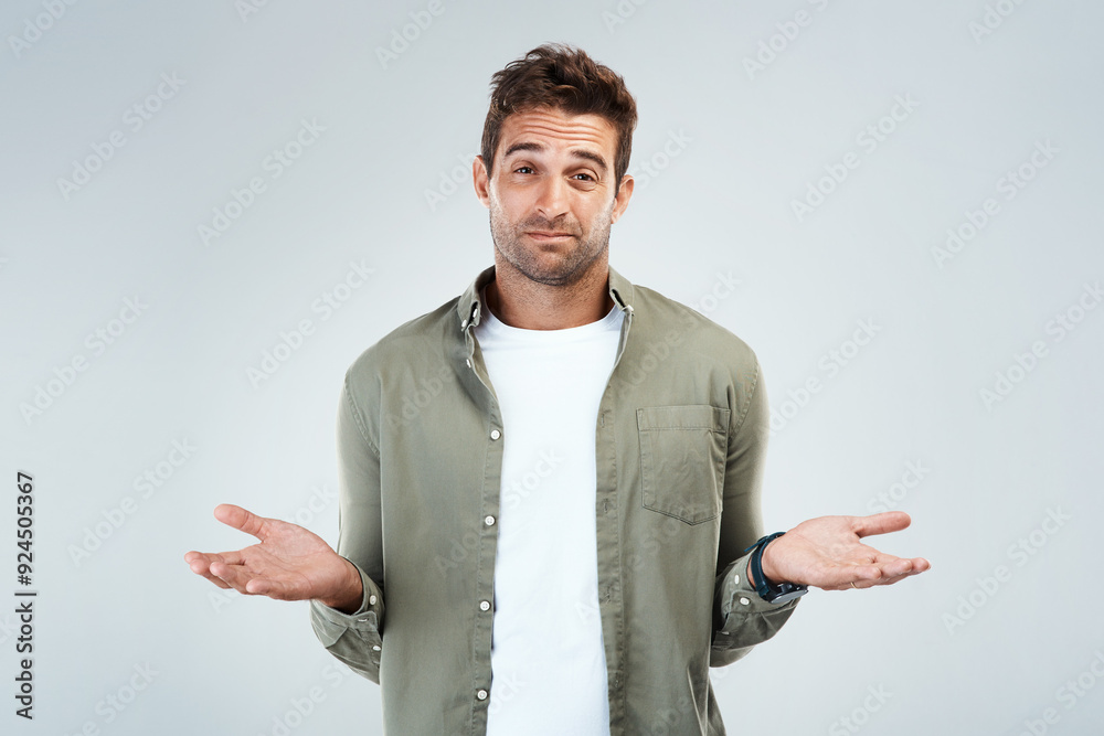 Poster Man, portrait and confused by doubt, option or decision in gray background with hand gesture in studio. Male person, choice and thinking as frustrated consumer, questioning and contemplating for idea