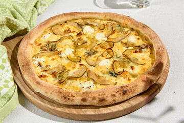 Gourmet Pear and Gorgonzola Pizza on Wooden Board - Italian Cuisine