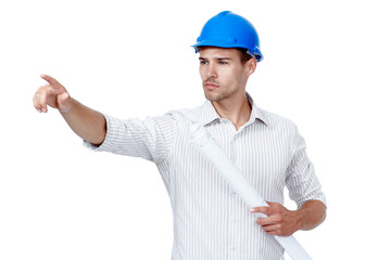 Architect, man and pointing with blueprint in studio for project, development or direction. Architecture, helmet and contractor with gesture for floor plan, building or inspection on white background