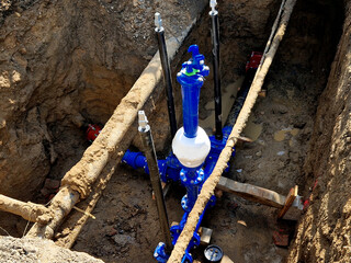 pipe repair for a crash. connection of new pipes by plumbers and water shut-off to the house in the...