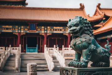 Obraz premium A majestic bronze lion statue standing in front of the Forbidden City, the symbolic building of China. China travel, culture, history, tradition concept.