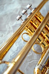 Naklejka premium Close-up shot of a trumpet sitting on a table, ideal for use in editorial or commercial contexts where a musical instrument is needed