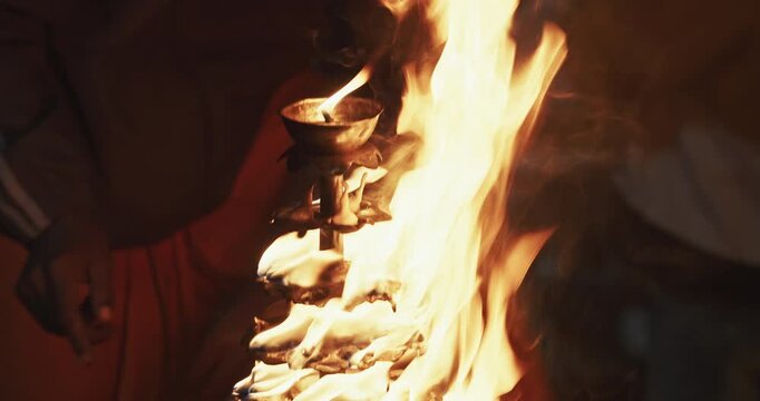 Varanasi, Uttar Pradesh, India. Close-up View On Candle Holder With Lit Candles On Ganga Maha Aarti Ceremony Begins. Fire Puja Ritual In Varanasi. Traditional Ganga Aarti At Ghat. Arti Or Arati Is