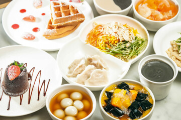 cold noodles, shredded chicken and dumplings Strawberry Souffle Waffles, Molten chocolate lava cake, Ginger sesame soup balls, Mango sago grass Jelly, Stewed Papaya Snow Fungus, Sesame paste