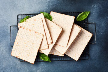 Matzoh jewish holiday bread. Traditional ritual Jewish bread. Top view, on a gray background.