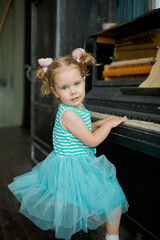 little girl playing piano