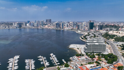 Aerial view of Luanda's coastline and urban skyline during a clear day