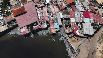 Top down view of slums in Luanda, Angola showing crowded housing and waterways
