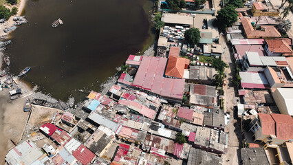 Top down view of informal settlements in Luanda, Angola with river and housing structures