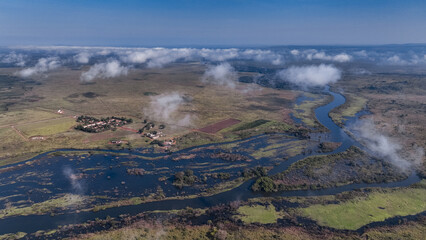 Aerial view of the lush river delta in Angola with winding waterways and surrounding vegetation...