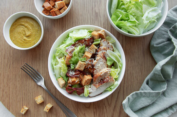 A bowl  of  Caesar salad