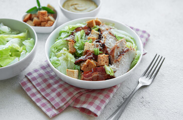 A bowl  of  Caesar salad
