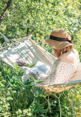 Young woman relaxing in a hammock