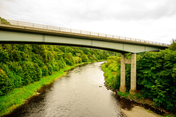 Road bridge over the river Tweed in summer shot near the Scottish Borders abbey town of Melrose, room for text