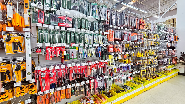 Tools put up for sale in a hardware store. Hardware and carpentry tools hung and exhibited for sale in the shop. The store for installation and maintenance, Thailand, August 16, 2024