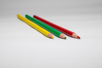 colored pencils for drawing and coloring. red, yellow, green pencils