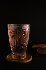 Photo of a glass of tea with flash.