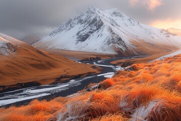 Snow-capped Mountain Peak with a Winding River and Orange Grass in Iceland