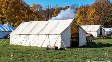 American Civil War reenactment with canvas tents, campfires, and military equipment amidst autumn foliage