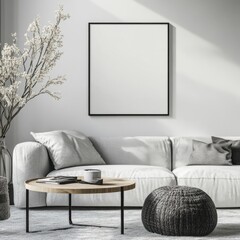 A white couch sits in front of a black framed picture