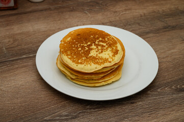 Delicious pancakes on a wooden table