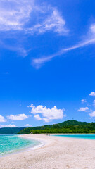 Bonbon Beach white sand on a sunny day. Portrait. Romblon Island, Philippines