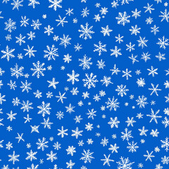 This seamless pattern showcases white snowflakes on a vibrant blue background, creating a wintry and festive mood, perfect for seasonal projects or holiday-themed designs.
