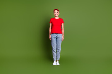 Full body photo of attractive mature lady professional delivery employee stand wear red uniform workwear isolated on khaki color background