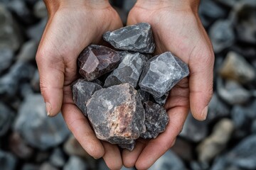 Freshly mined mineral stones held in hands, ideal for mining and geology projects