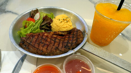 Luxurious and glorious sirloin steak dinner with premium sides a feast for the senses along with potatoes, sauces and condiments good for recipes and cook book content