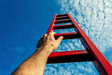 Plakat Achieving Goals. Man Climbing Red Stairs Leading to the Sky. First person view