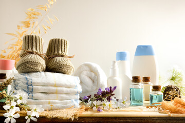 Organic diapers and baby care products on wooden table