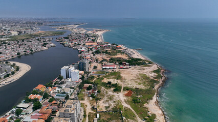 Aerial views of Luanda showcasing the coastline, urban landscape, and river confluence in Angola...