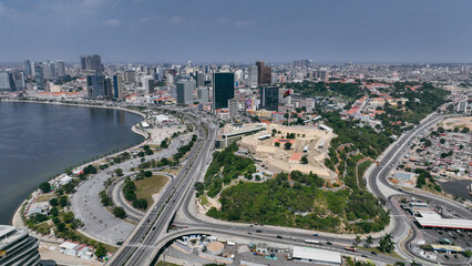 Aerial view of Luanda showcasing coastal landscape, urban development, and the iconic Fort of S&atilde;o Miguel