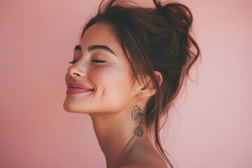 Fototapeta premium A close up of a woman's face with tattoos and her eyes closed