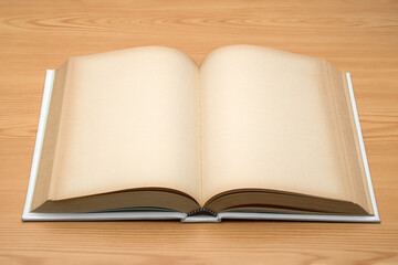Blank page open old book on wood background