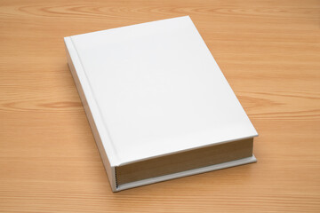 Mock up hardcover book on wood background