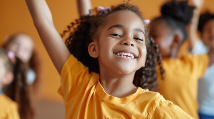 Happy multiracial children dancing energetically in choreography class during a creative lesson