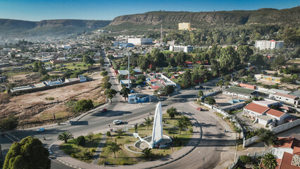 Aerial view of Lubango City showcasing urban landscape and the iconic monument in Angola during clear weather