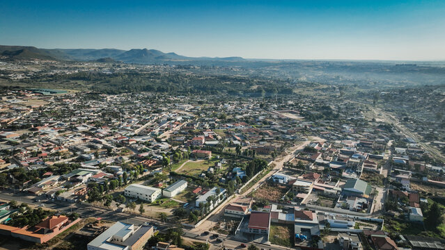Aerial view of Lubango City showcasing urban landscape and surrounding mountains in Angola