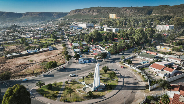 Aerial view of Lubango City showcasing urban landscape and the iconic monument in Angola during clear weather