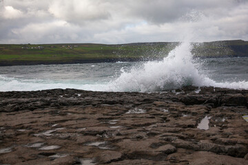waves crashing on rocks