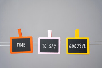 Inscription Time to say goodbye on wooden boards. Relations between people.