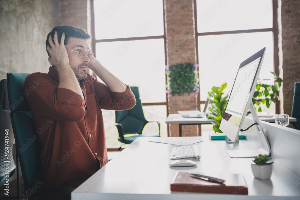 Sticker Photo of handsome man touch head shocked scared sit tables coworking successful businessman wear brown formalwear creative light office